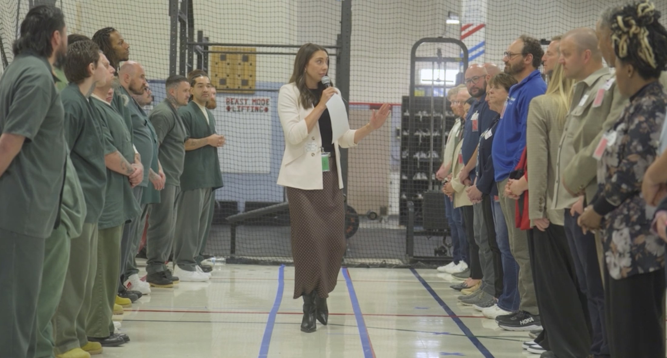 A facilitator and participants during a group activity inside prison